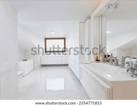 Luxury chrome shower in modern marble bathroom.