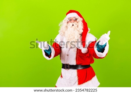 Portrait of bearded santa claus showing thumb up nice agree deal done isolated over bright vibrant vivid glow green color background