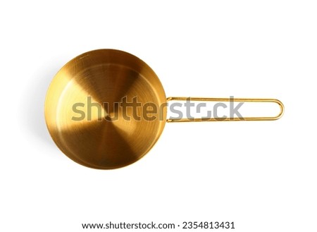 Golden measuring cup on white background Royalty-Free Stock Photo #2354813431