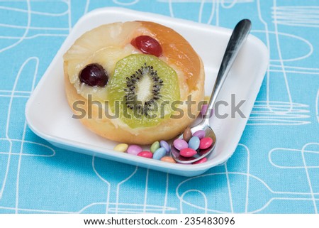 fruit doughnut with cherry and kiwi