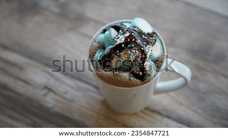 Top view shot of hot chocolate cup with marshmallow