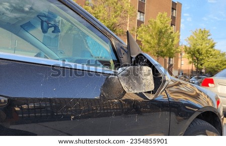 The car mirror broke due to an accident and was parked for a long time until it was dusty and became cobwebs. Royalty-Free Stock Photo #2354855901