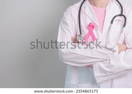 Pink October Breast Cancer Awareness month, doctor with pink Ribbon in hospital for support people life and illness. National cancer survivors month, Mother and World cancer day concept Royalty-Free Stock Photo #2354865173