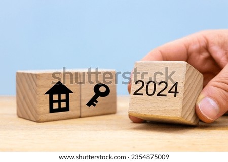 housing construction in 2024. Sale,rent, situation on the housing market. Concept, Wooden blocks and house icons, keys and new year