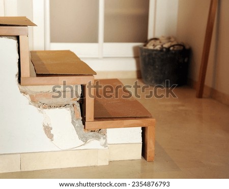Interior design work for the comprehensive reform of a two story house. Solid beech wood staircase under construction.  Royalty-Free Stock Photo #2354876793