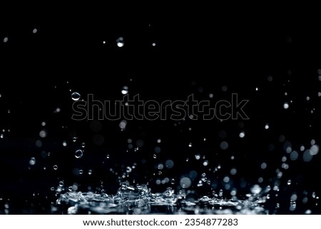 rain background. water droplets, splashes on a black background Royalty-Free Stock Photo #2354877283