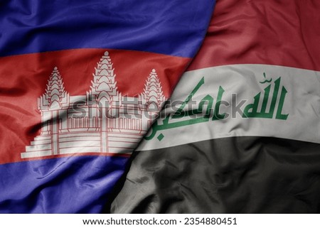 big waving realistic national colorful flag of cambodia and national flag of iraq . macro