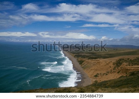 Beautiful contrast of land and sea with spectacular cloud formation