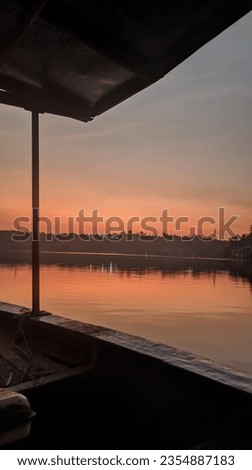 photo of a sunset view on a lake on a boat that can be used as a background
