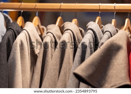 Coats hanging on hangers in a clothing store