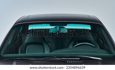 Windshield of a car on a black car Royalty-Free Stock Photo #2354896639