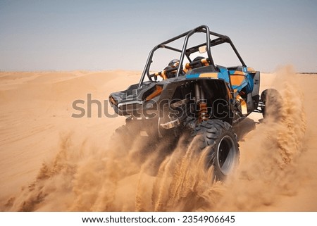 sand dune bashing ofrroad. utv rally buggy Royalty-Free Stock Photo #2354906645