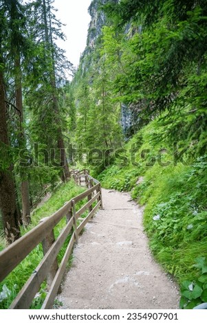Path for walking around the Braies lake or Pragser Wildsee in the Dolomites, South Tyrol, Italy. High quality photo
