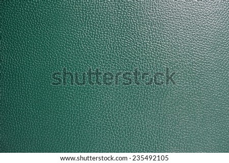 Green leather background.