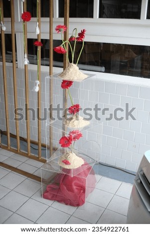 red flower artwork cabinet instalation