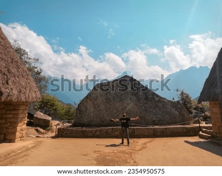 tourist with backpack with travel backpack looking at machu picchu in Peru ,Concept of tourism,Travel,Photographer