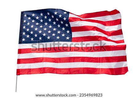 Large USA flag flying. Isolated over white background