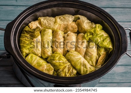 cabbage rolls in the crock pot ready to be cooked Royalty-Free Stock Photo #2354984745