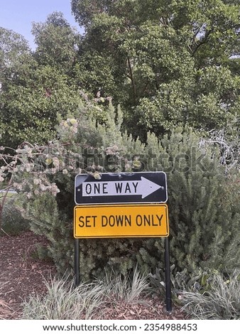 One way sign with nature back