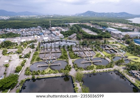 Aerial view High angle view Top down drone shot of the sewage treatment plant.The Solid contact clarifier tank type sludge recirculation in water treatment plant. Industrial wastewater treatment plant