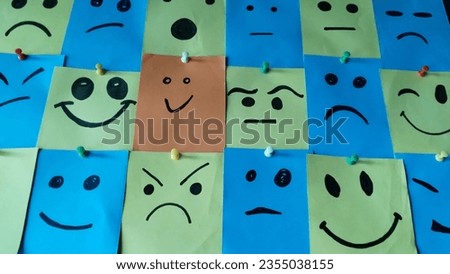 A group of paper notes with smiley faces.