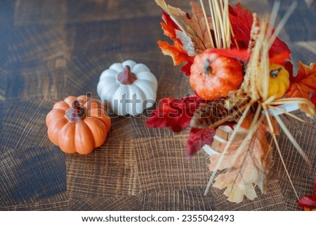 Decorative arrangement of pumpkin and beautiful leaves