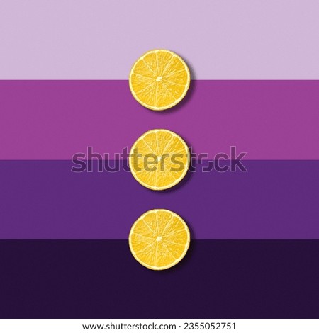 Three lemon fruit slices on electric purple background, abstract pop art picture 
 Royalty-Free Stock Photo #2355052751
