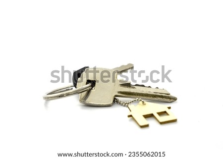 Real estate concept . Key ring and keys on white  background . Copy space