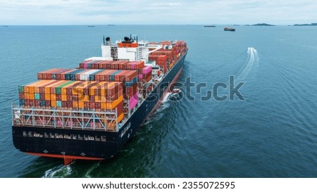 Aerial Stern view of cargo container ship carrying container from custom container depot go to ocean concept freight shipping by ship service on blue sky .Freight Forwarding Service