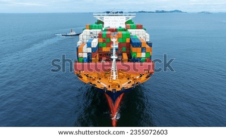 Aerial front view of cargo container ship carrying container from custom container depot go to ocean concept freight shipping by ship service on blue sky .Freight Forwarding Service