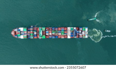 Aerial top view of cargo container ship carrying container from custom container depot go to ocean concept freight shipping by ship service on blue sky .Freight Forwarding Service