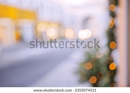 Blurred background of a street decorated for the New Year.Place for advertising. Happy New Year. Out of focus.