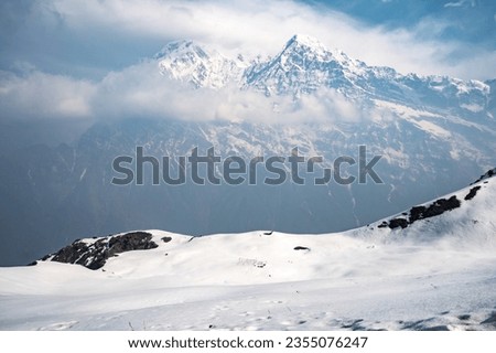 Spectacular view of Mt.Annapurna South (7,219 m) and Mt.Hiunchuli (6,441 m) seen from Mardi Himal view point in the Annapurna region of Nepal.  Royalty-Free Stock Photo #2355076247