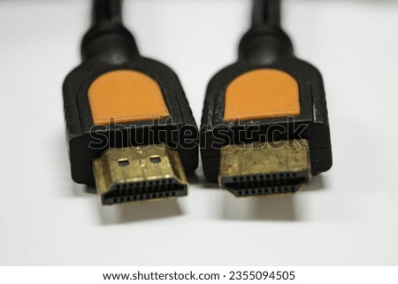 a slightly rusty HDMI cable on a plain white background