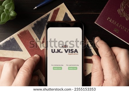 UK visa application  concept: man fill a Uk visa application form on his smartphone