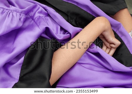 Wearing christian dress ready for baptism. Hemiplegia contracture Cerebral Palsy. Royalty-Free Stock Photo #2355153499