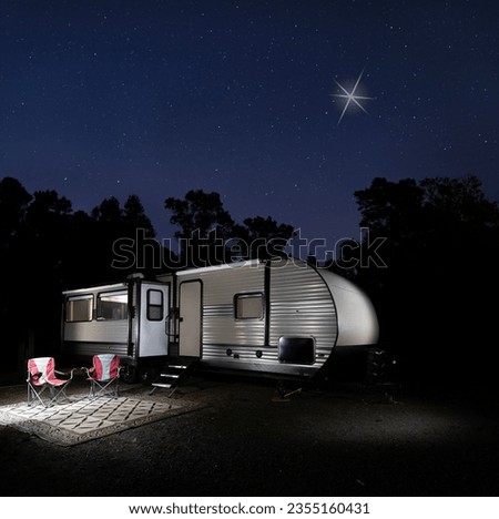 RV in a remote campsite with the Christmas Star shining brightly above