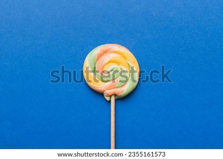 Colorful candies, lollypop on the colorful background, multicolored minimal style top view.