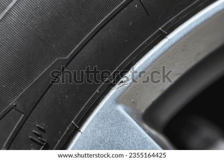 Chipped alloy wheels. Chipped abrasion of silver alloy wheels around the edge of the wheel. Repair of car wheels. Wheel truck is abrasion damage. Royalty-Free Stock Photo #2355164425