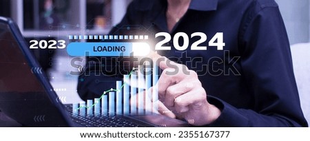 Businessman point loading progress bar changing year 2023 to 2024 and plan growing business