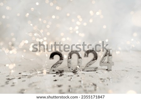 happy new year 2024 background new year holidays card with bright lights,gifts and bottle of hampagne
