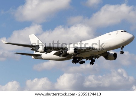 A Boeing 747 cargo freighter plane landing at Miami Airport Royalty-Free Stock Photo #2355194413