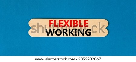 Flexible working symbol. Concept words Flexible working on beautiful wooden stick. Beautiful blue table blue background. Business flexible working concept. Copy space.