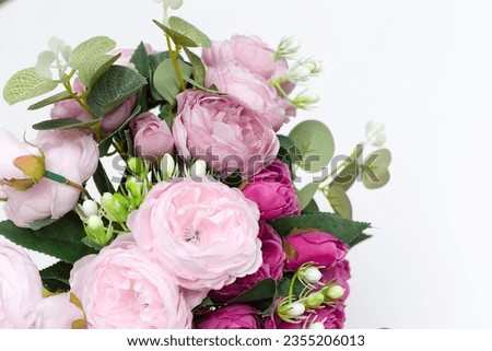 Fresh, lush bouquet of colorful flowers for present isolated on white background. Wedding bouquet of roses and freesia flowers