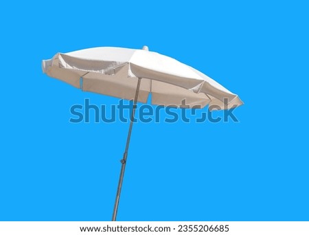 A beach umbrella isolated on the blue background