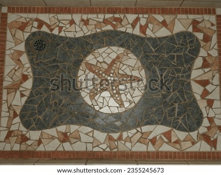 Blue sea star shower floor ceramic tiles background