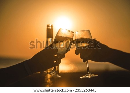 Wine glasses at sunset on the beach. Selective focus. Nature.