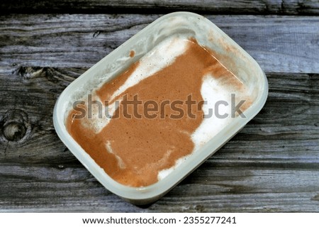 Chocolate and Vanilla Ice cream mixed together and frozen, ready to be served, Ice cream is a frozen dessert typically made from milk or cream that has been flavored with a sweetener, selective focus
