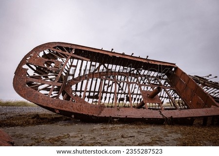 Skeleton of Shipwreck called Ambassador on the  coast of Magellan Strait, rusty warship wreck, Tierra Del Fuego, Chile Royalty-Free Stock Photo #2355287523
