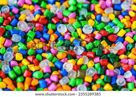 Polymeric dye. Plastic pellets. Colorant for plastics. Pigment in the granules. Polymer beads Royalty-Free Stock Photo #2355289385